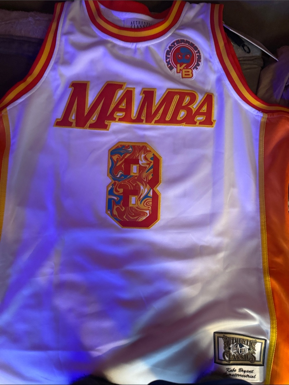 Classic White Mamba Basketball Jersey with Red and Yellow Accents